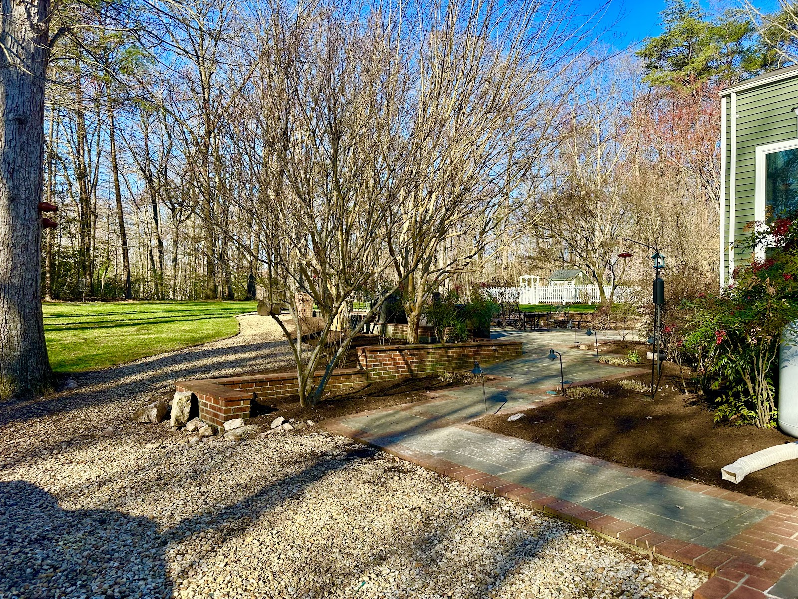 Gravel path and cleared landscaping beside a home